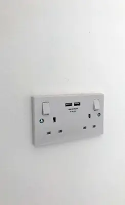 a white electrical outlet on a white wall at ApartHotel421 by Seafront Collection in Blackpool