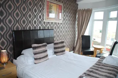 a bedroom with a bed with two pillows on it at Brincliffe Hotel in Blackpool