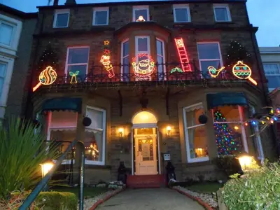 a house with christmas lights on the front of it at Savoy in Fleetwood