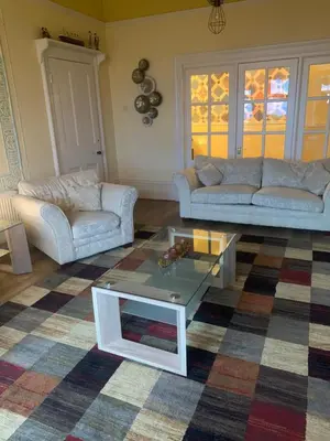 a living room with two couches and a coffee table at Savoy in Fleetwood