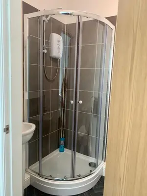 a shower with a glass enclosure in a bathroom at Be My Guest Liverpool in Liverpool