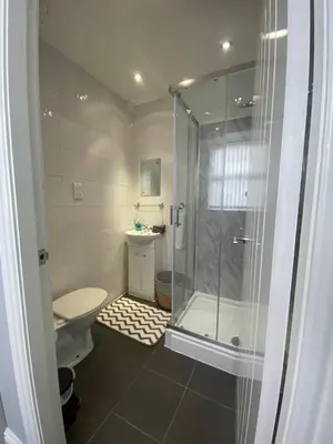 a bathroom with a shower and a toilet at Sheil Road Studios - Be My Guest Liverpool in Liverpool