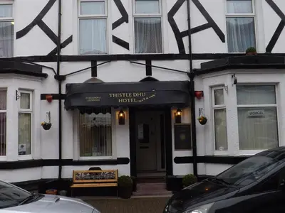 a building with a sign on the front of it at Thistle Dhu Guest House in Blackpool