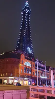 a building with a tower with a clock on it at The Tudor in Blackpool