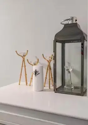 a shelf with a candle and a lantern on it at The Central Suite Blackpool-Best Holiday Letting Home in Blackpool in Blackpool