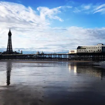 a pier with a view of the eiffel tower at The Mayfield Hotel in Blackpool