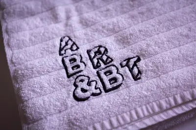 a towel with the word bacon written on it at ART B&B in Blackpool