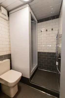 a bathroom with a toilet and a shower at 1 Bedroom Newton Apartment l Free Parking l Wigan Royal Infirmary l Haigh Hall l Central Location in Wigan