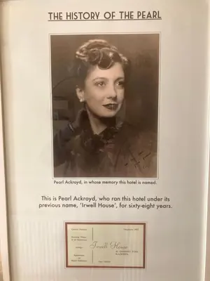 a black and white photo of a woman in a book at Pearl Hotel in Blackpool