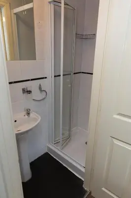 a bathroom with a shower and a sink at The Aspire in Blackpool