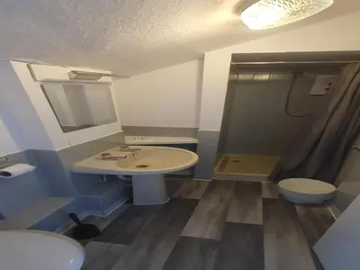 a bathroom with a sink and a shower and a toilet at South Beach Kings Promenade Hotel in Blackpool