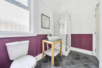 a bathroom with a toilet and a sink at Willin House Hotel in Blackpool