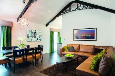 a living room with a couch and a table at EPIC Apart Hotel - Seel Street in Liverpool