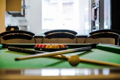 a pool table with cue balls and chopsticks on it at Liverpool City Centre - Spacious Duplex - 6 Bedrooms - Sleeps 14 People in Liverpool