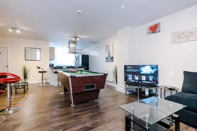 a living room with a pool table and a couch at Liverpool City Centre - Spacious Duplex - 6 Bedrooms - Sleeps 14 People in Liverpool