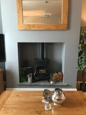 a fireplace in a living room with a stove at Cosy house set in historic town of Clitheroe in Clitheroe