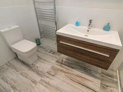 a bathroom with a sink and a toilet at Shore Beats Work - Capenwray 10 in Carnforth