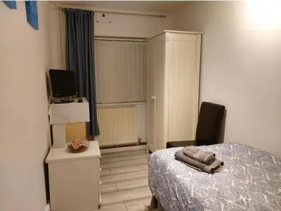 a bedroom with a bed and a television and a desk at Amazing Double Liverpool in Liverpool