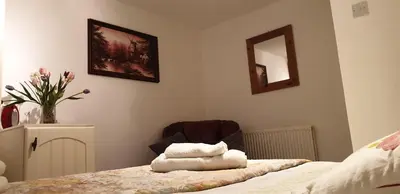 a bedroom with a bed with towels on it at Amazing Double Liverpool in Liverpool