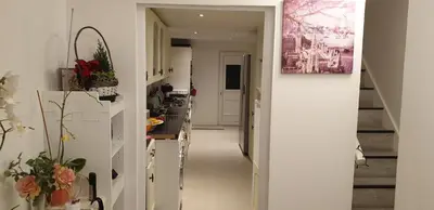 a hallway leading to a kitchen with white walls at Amazing Double Liverpool in Liverpool