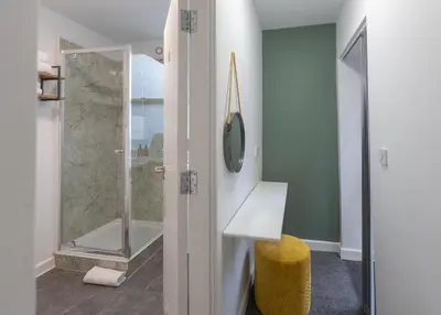 a bathroom with a shower with a glass door at City Haven Preston in Preston
