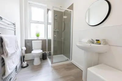 a bathroom with a shower and a toilet and a sink at Fulwood Heights in Preston