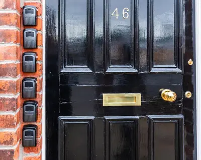 a black door with the number on it at Fulwood Heights in Preston