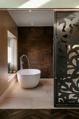 a bathroom with a large white bath tub next to a shower at The Old Hay Shed in Cartmel