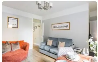a living room with a couch and a table at Liverpool Georgian Quarter 1 Bed Apartment Sleeps 4 in Liverpool