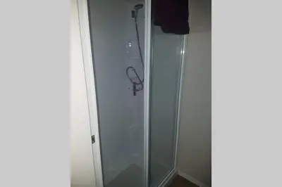 a shower stall with a glass door next to at Deluxe 3 bedroomed caravan on Marton Mere with CH DG and decking in Blackpool