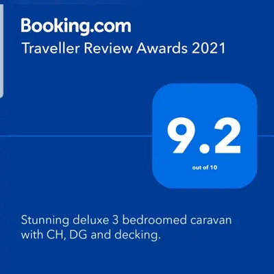 a screenshot of a cell phone with the text travelling review awards at Deluxe 3 bedroomed caravan on Marton Mere with CH DG and decking in Blackpool