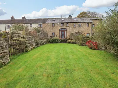 an old stone house with a large yard at Usherwoods Barn in Lancaster
