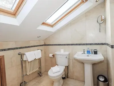 a bathroom with a toilet and a sink at Usherwoods Dairy in Lancaster