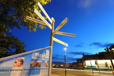 a street sign with arrows pointing in different directions at 6Adelphi in Preston