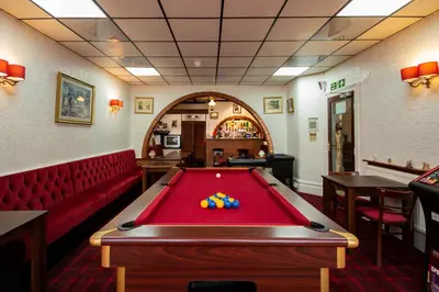 a room with a pool table in a restaurant at The Ferndale Hotel in Blackpool