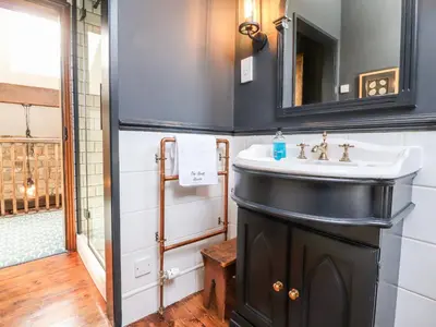 a bathroom with a sink and a mirror at The Boot Room in Preston
