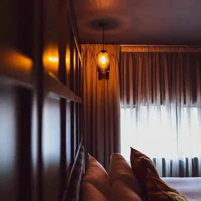 a living room with a couch and a window at The Baltic Hotel in Liverpool