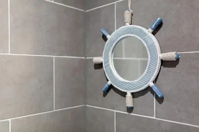 a bathroom with a round mirror in a shower at Superb Spacious House For Contractors & Families & Private Parking By Liverpool Short Stay in Liverpool