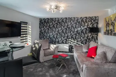 a living room with a couch and chairs and a table at 2 Bedrooms Sleeps 6 Near Top Blackpool Attractions in Blackpool