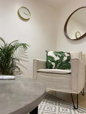 a living room with a chair and a table at Womack Lodge in Saint Helens