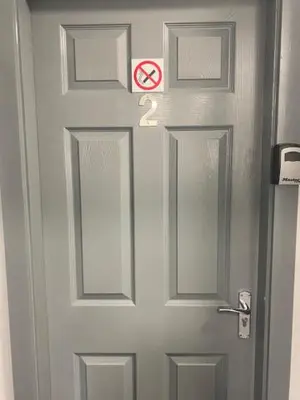 a door with a no smoking sign on it at The Anfield Rooms in Liverpool