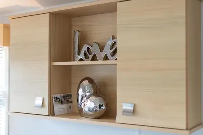 a wooden cupboard with a vase in it at Inside No. 9 Retreat in Carnforth