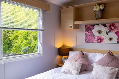 a bedroom with a bed and a window at Inside No. 9 Retreat in Carnforth