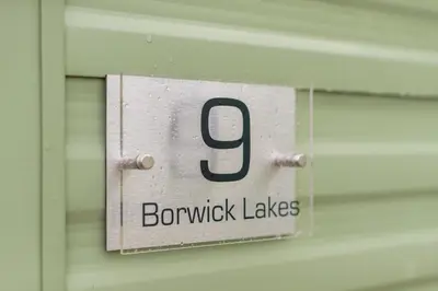 a sign on a door with the number on it at Inside No. 9 Retreat in Carnforth