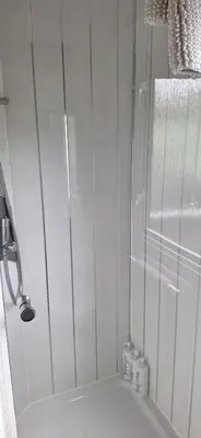a shower with a glass door in a bathroom at Inside No. 9 Retreat in Carnforth