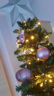 a christmas tree with lights and ornaments on it at Inside No. 9 Retreat in Carnforth