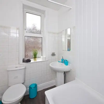 a white bathroom with a toilet and a sink at Liverpool City Stays - Economy Room Close to city centre GG in Liverpool