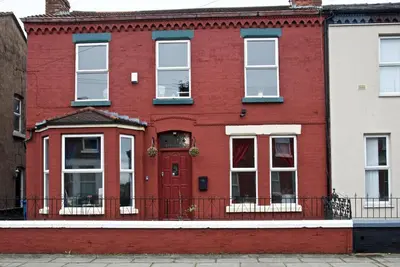 a red brick house with white windows and a red door at Liverpool City Stays - Economy Room Close to city centre GG in Liverpool