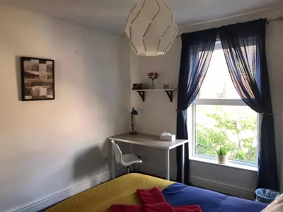 a bedroom with a bed and a desk and a window at Liverpool City Stays - Economy Room Close to city centre GG in Liverpool