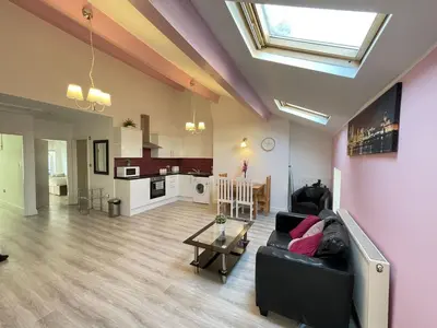 a living room with a couch and a table at Liverpool City Stays - Economy Room Close to city centre GG in Liverpool